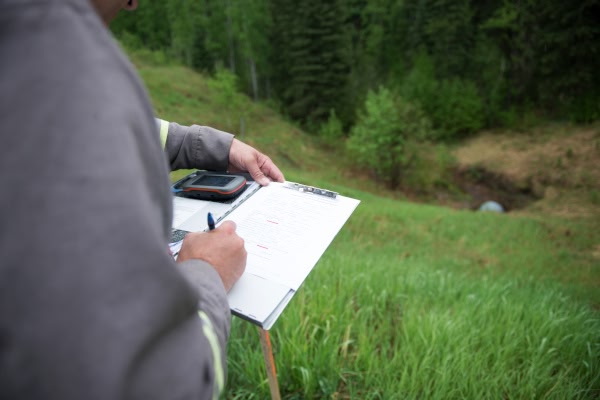 A regulator inspects a site